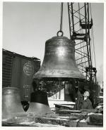 Wendell Wescott inspecting a Beaumont Tower bell; January 6, 1959