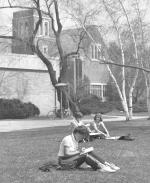 Students sitting in the grass and the Chapel; April 11, 1978