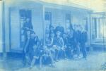53. A group of men sitting on the porch of house, circa 1888.