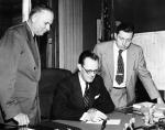 John Hannah Observes signing of the Michigan State University Bill, 1955