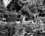 Students sit near a pond in the Beal Botanical Garden, 1940's