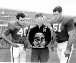 Coach Daugherty and two place gaze into crystal ball, 1962