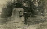 Man drinking from the Class of 1900 fountain, date unknown