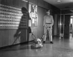 A custodian buffing the floor, 1957