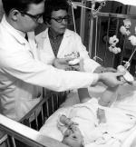 Medical student and daughter at Sparrow Hospital, 1967