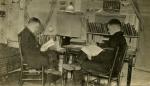 Two Male Students Reading in a Dorm Room