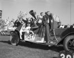 Cheer leading team in parade car, 1954