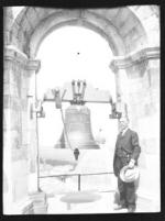 Man standing next to a bell (Frank M. Benton papers), circa 1880s