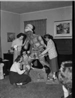 Co-eds work on a Spartan statue for homecoming, 1948