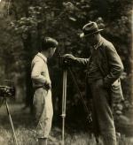 Onn Mann Liang inspecting camera, circa 1924