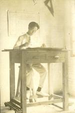 Onn Mann Liang working at desk, 1921