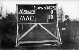 Scoreboard from a M.A.C.-Marquette football game, 1909 title=Scoreboard from a M.A.C.-Marquette football game, 1909