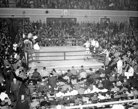 Boxing Ring with Large Crowd title=Boxing Ring with Large Crowd