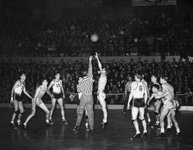 Tip off of a basketball game, 1940 title=Tip off of a basketball game, 1940